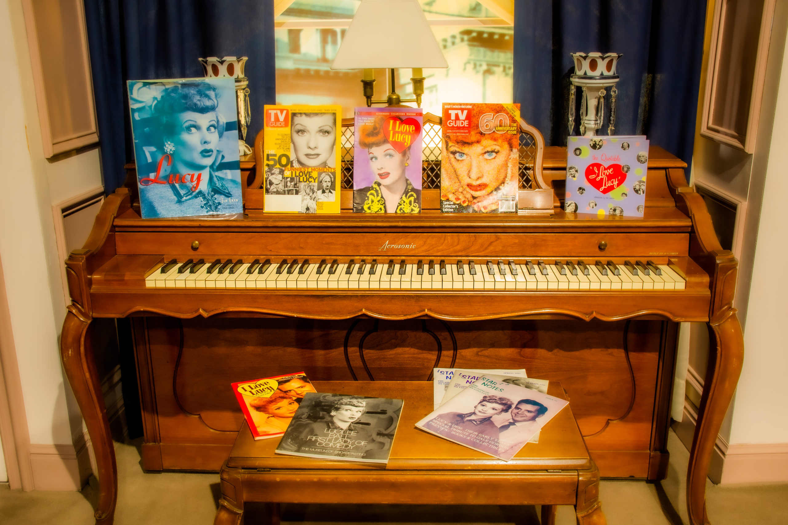 Vintage I Love Lucy magazines displayed on piano