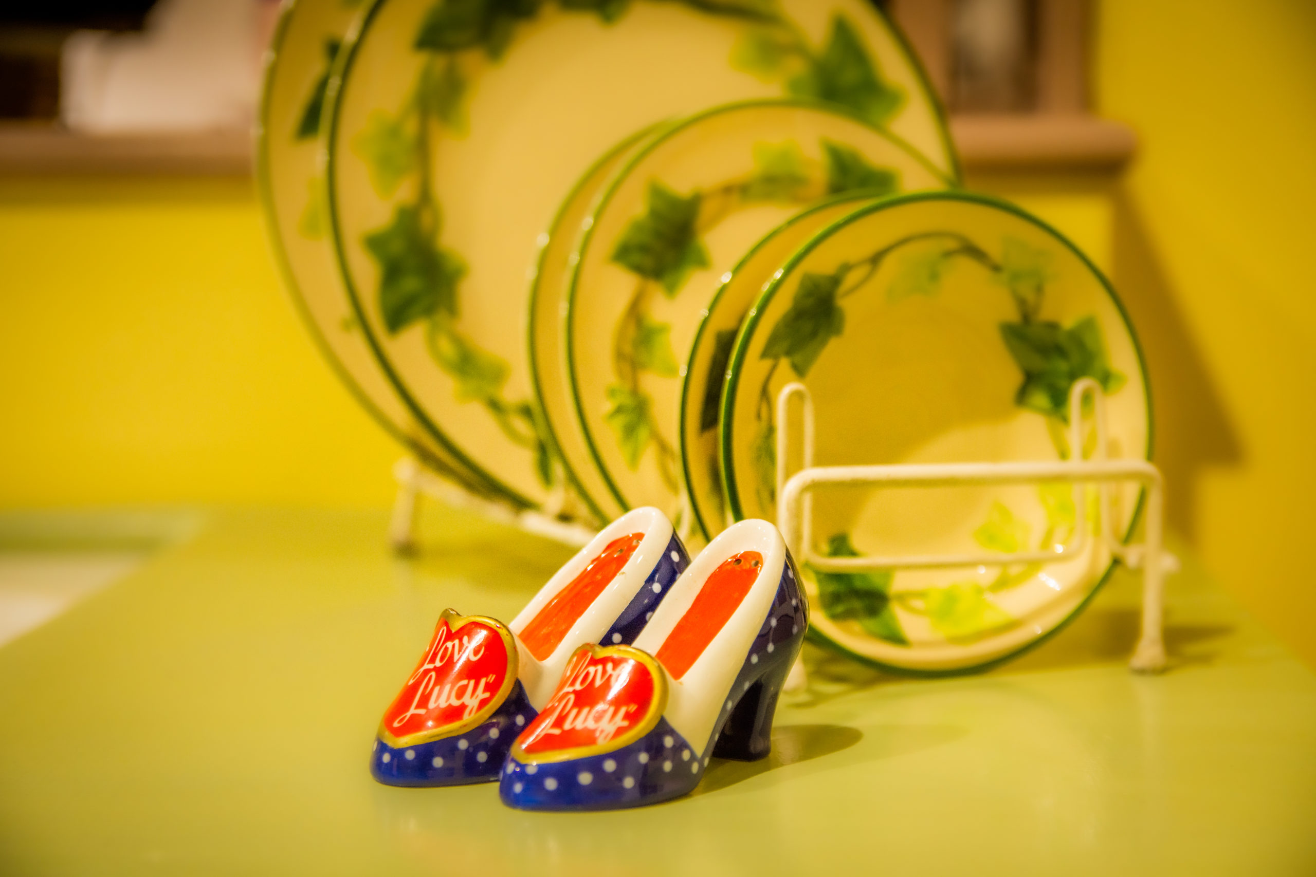 I I Love Lucy shoe salt and pepper shakers displayed infront of kitchen dining set